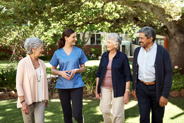 Nurse and four residents on a walk